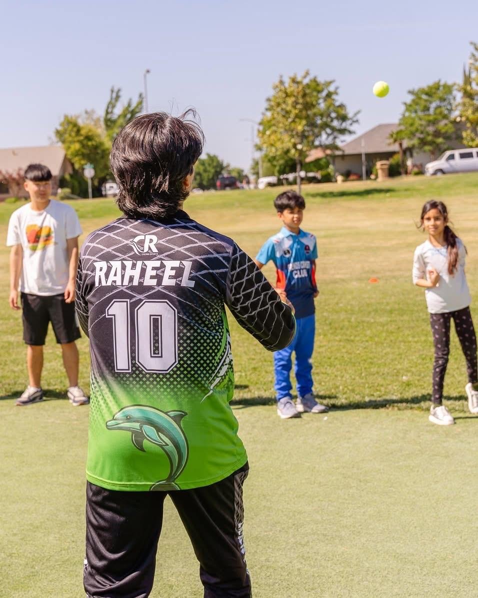 Coach Raheel leading a youth cricket drill