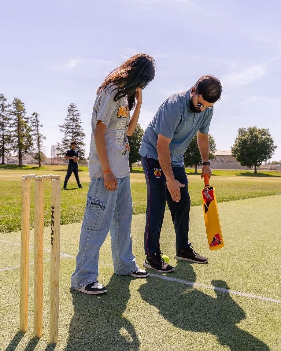 Players practicing batting and wicket awareness